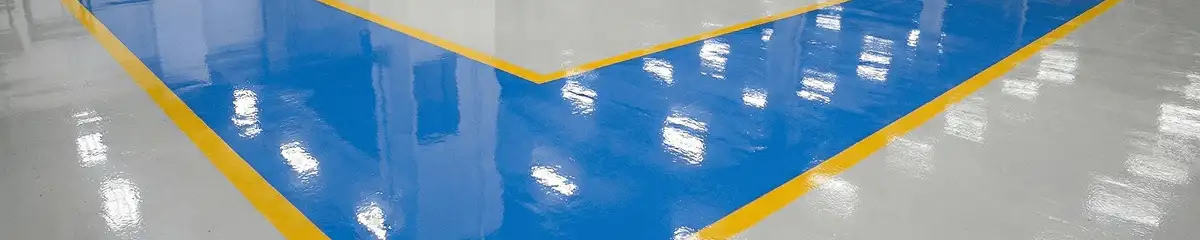 A factory floor professionally covered and marked with epoxy flooring in Lowell, MA