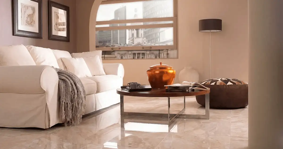 Modern living room with professionally installed marble flooring, a beige sofa, coffee table in Lowell, MA