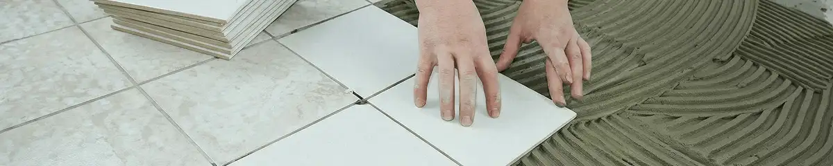 Professional installing white tile floors in Lowell, MA