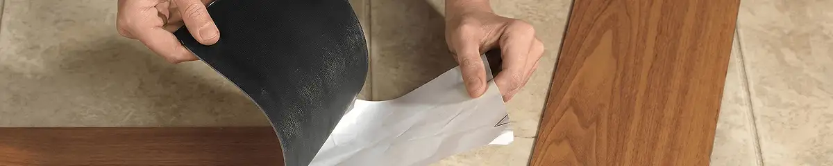 A professional installing vinyl flooring in Lowell, MA